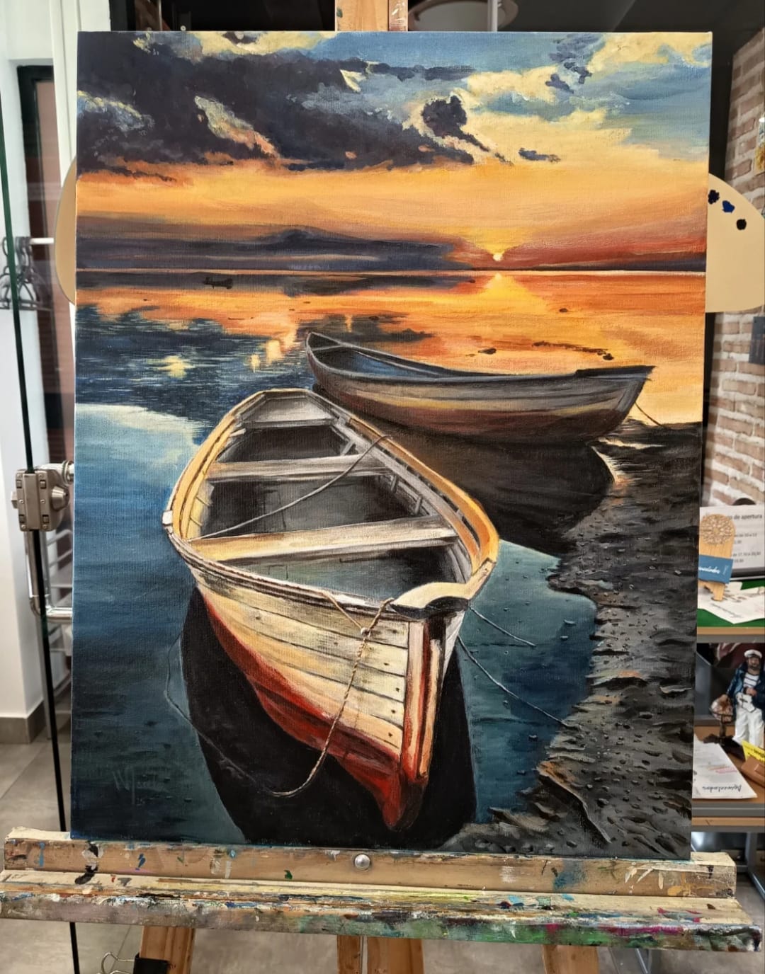 Pintura al óleo de barcas al atardecer