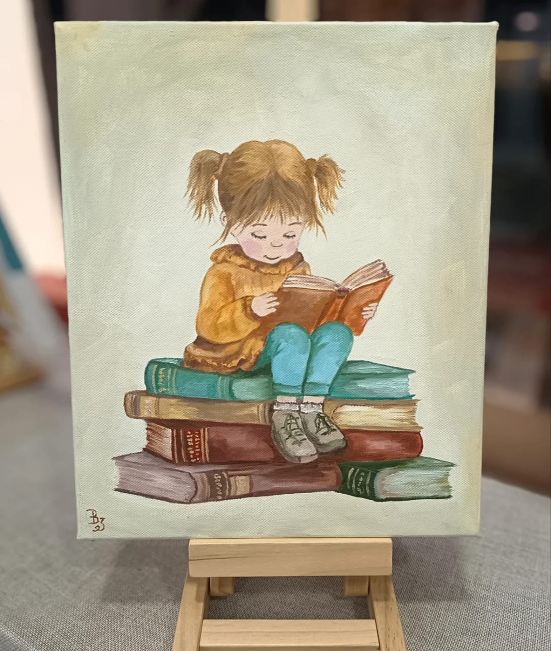 Pintura al óleo de niña leyendo sobre libros